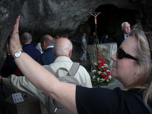 Patricia touching the Grotto