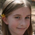 Anna with yellow flower