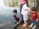 the kids feeding the ducks and geese at the monastery